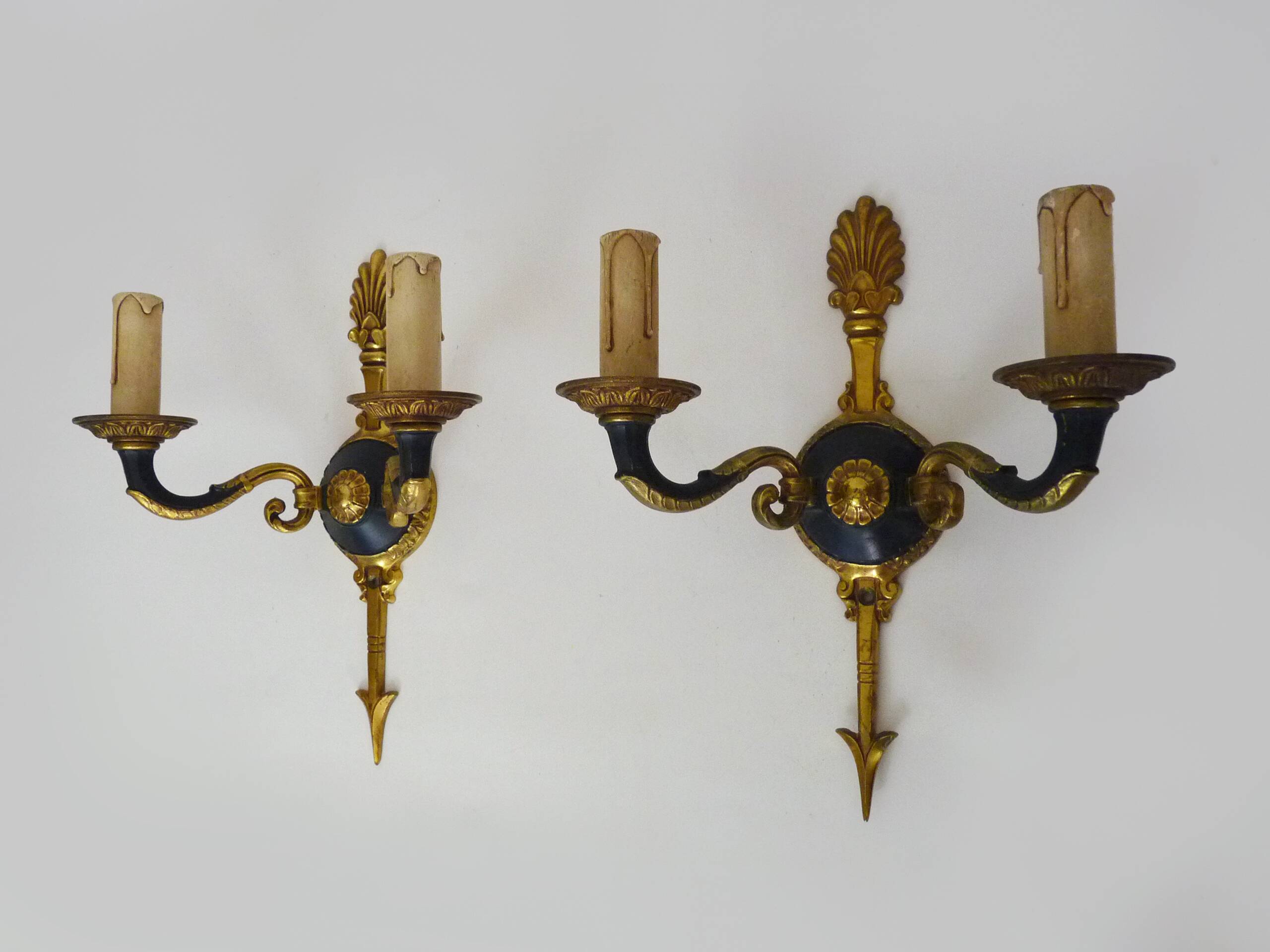 Pair of wall sconces in the Empire style with double lights in bronze.