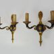 Pair of wall sconces in the Empire style with double lights in bronze.