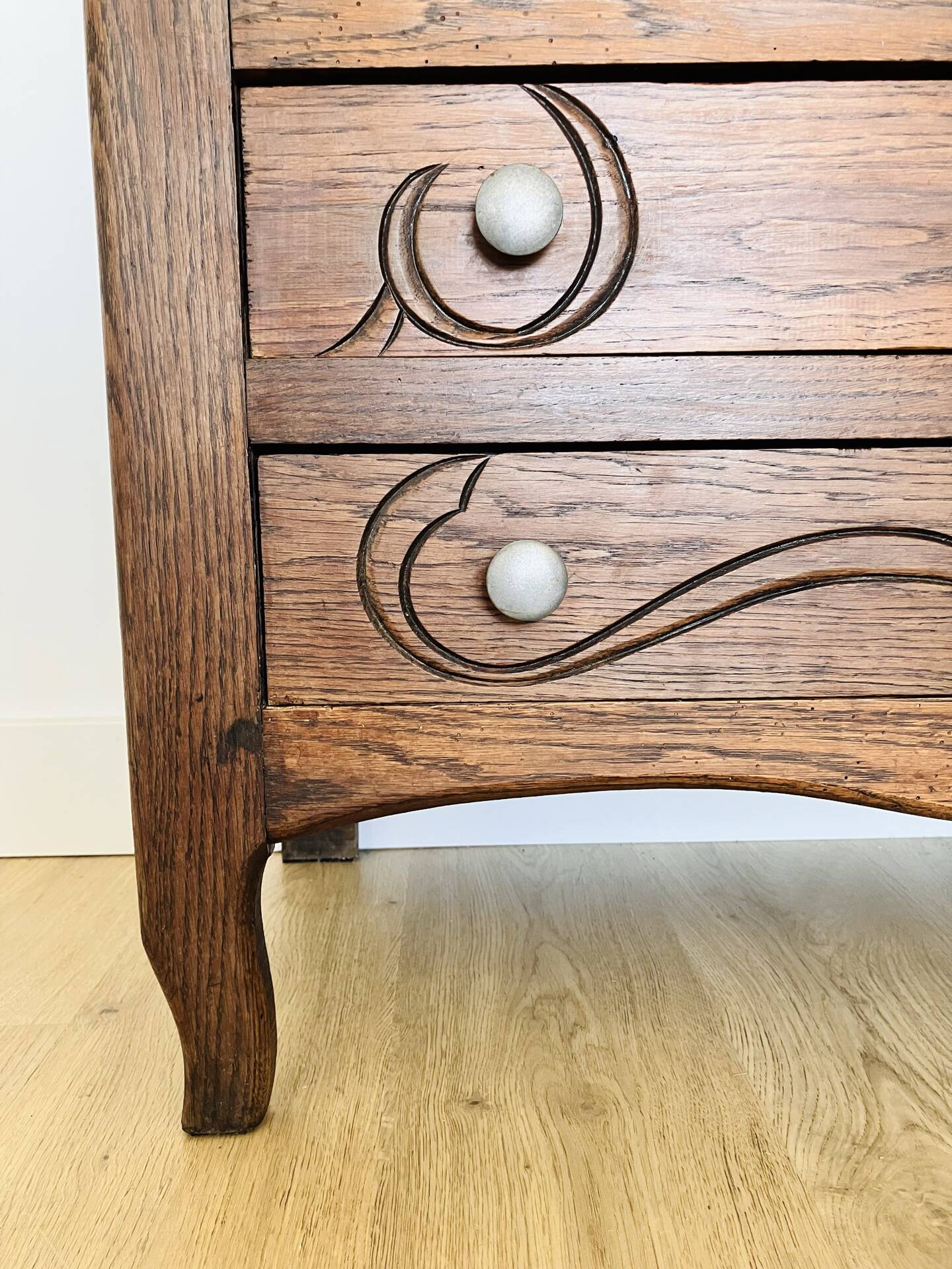 Antique commode with carved relief