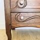 Antique commode with carved relief