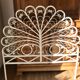 Rattan headboard & white wicker peacock tail décor 50-60s