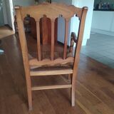 antique cherry and straw armchair with cathedral back