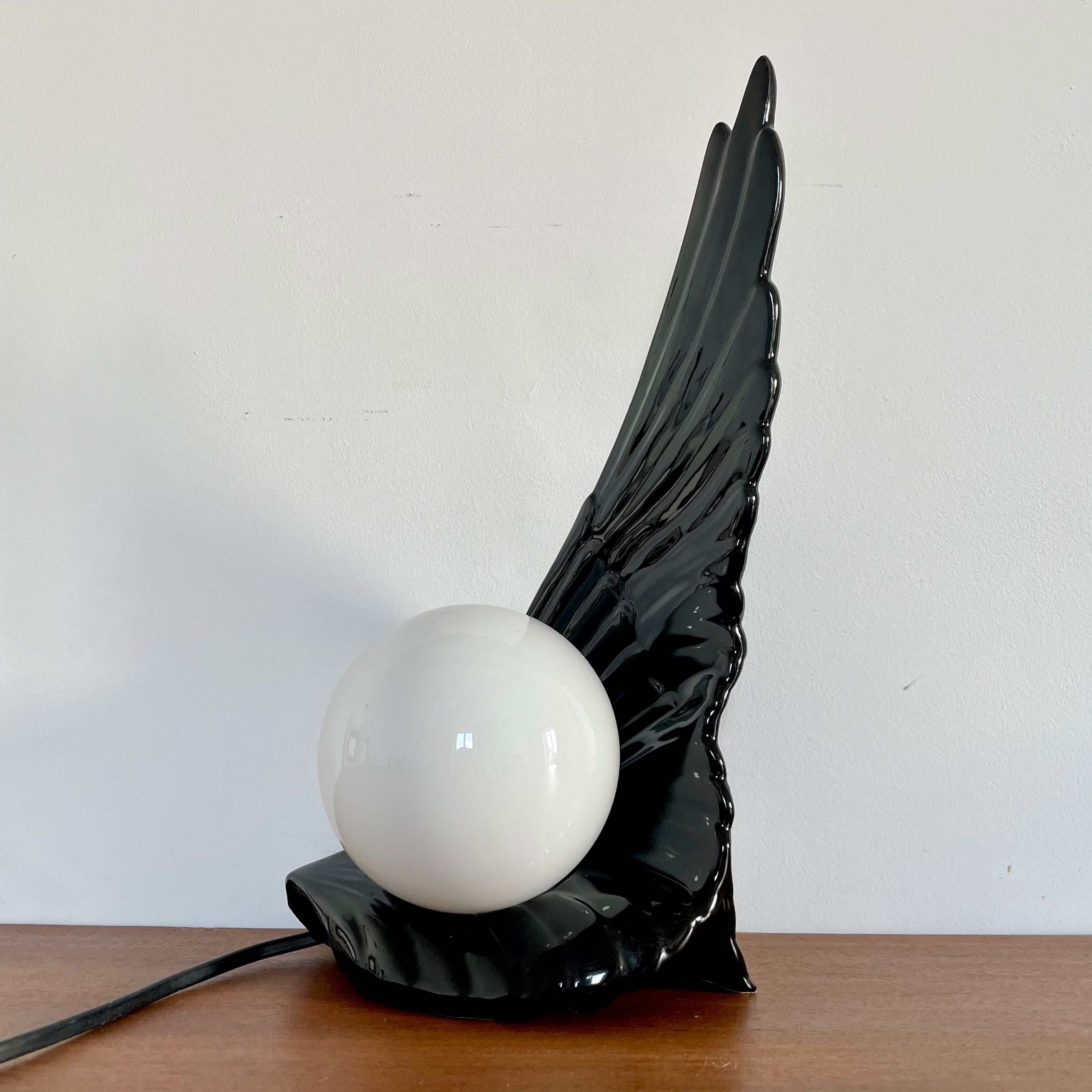 Ceramic wing and globe lamp