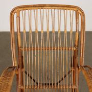 Vintage wicker armchair with magazine rack, Italy, 1960s