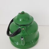 Old green kettle in enamelled metal
