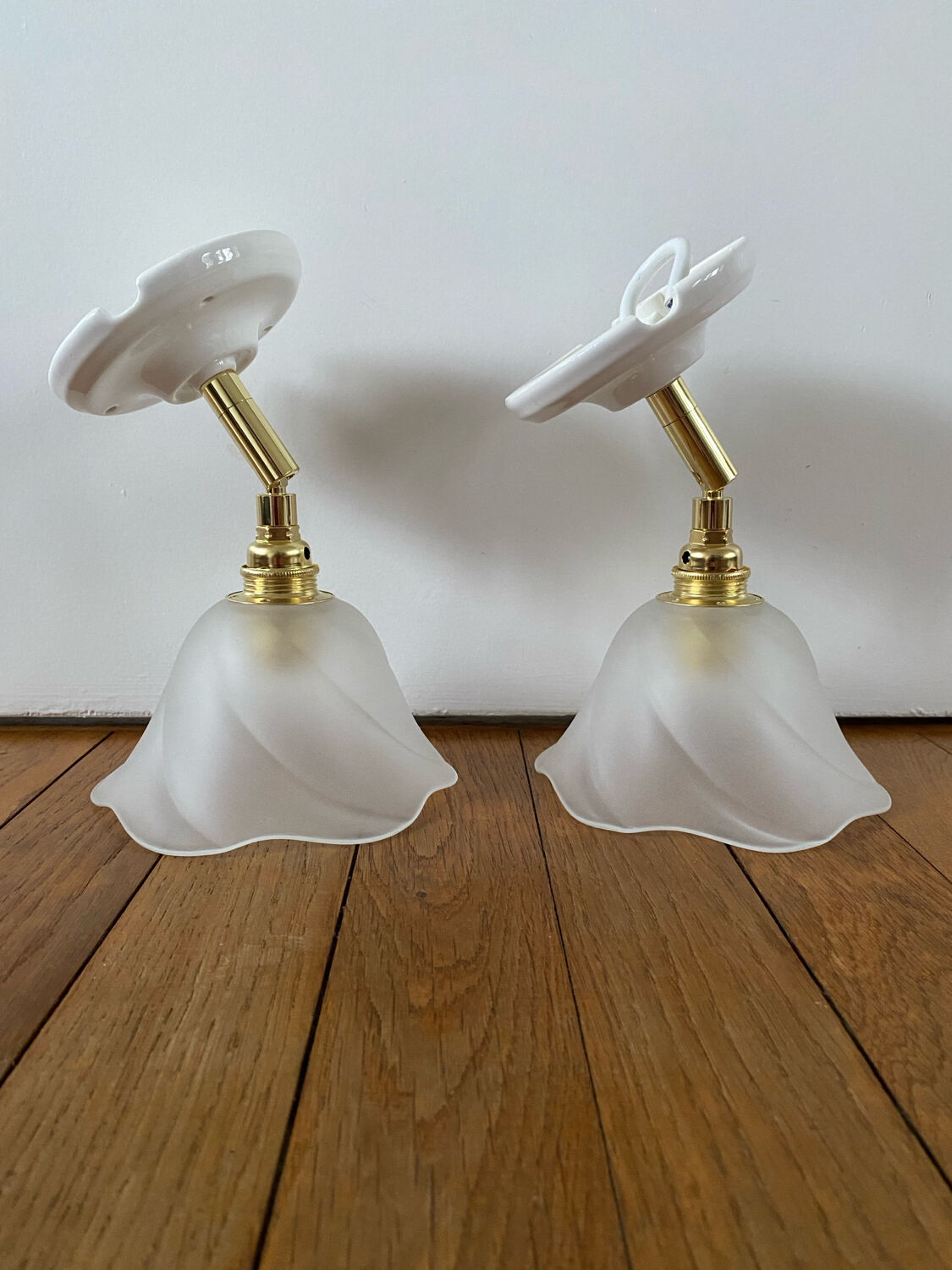 Pair of wall sconces with vintage globes