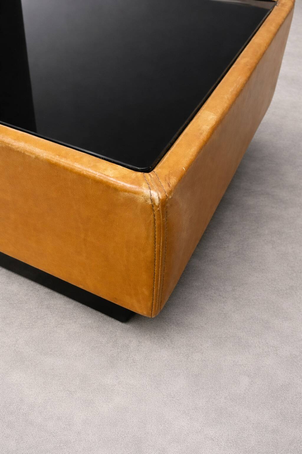 Vintage coffee table in leather and black glass – 1970s