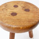 Brutalist tripod stool in solid wood, around 1960.