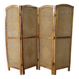 Handcrafted screen in exotic wood and rope.