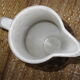 Glazed stoneware jug with hand decoration