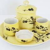 A yellow Art Deco ceramic tobacco service decorated with thistles from the 1920s to 1930s.