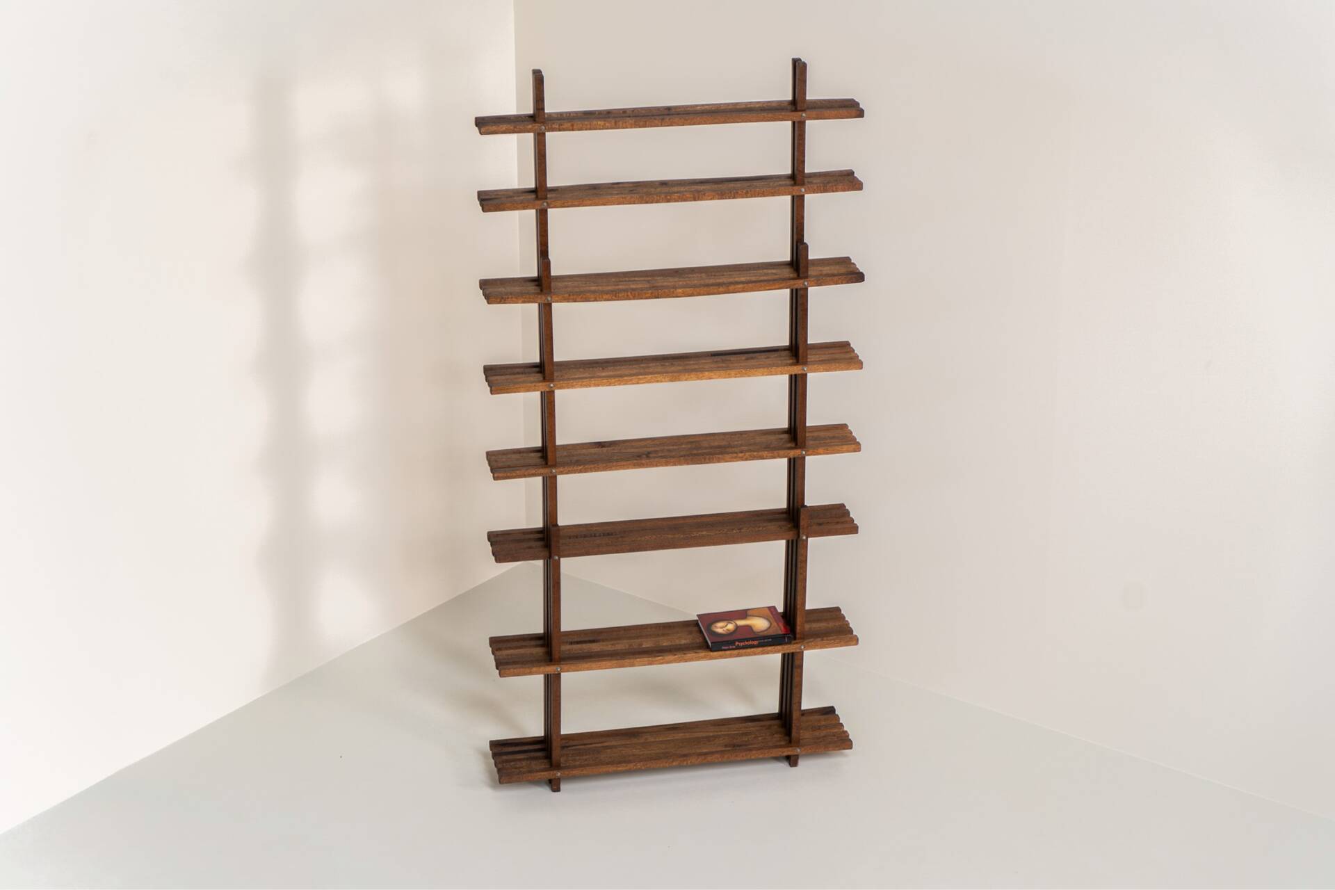 Sculptural wengé slat bookcase (Europe, 1960s).