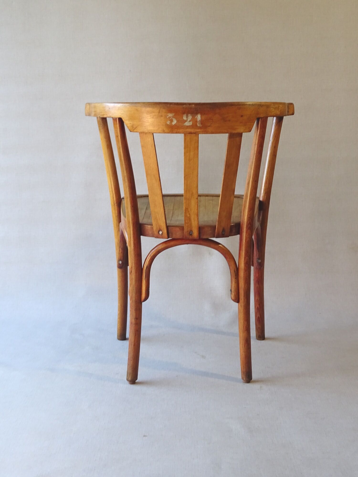 Fauteuil de bureau, bois blond, vers 1930, assise bois