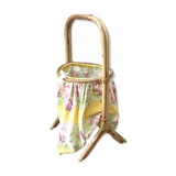 Worker in rattan and vintage fabric