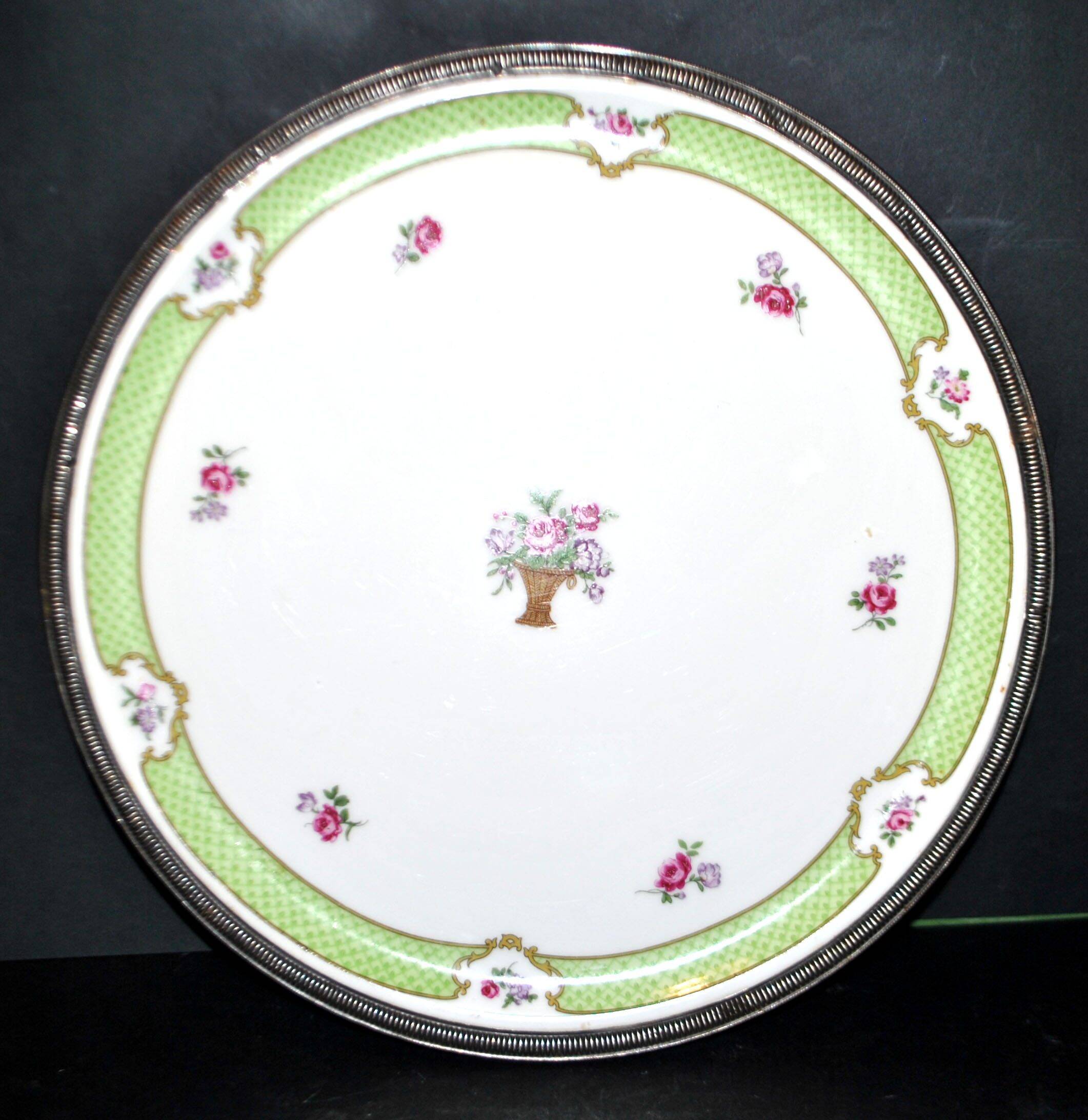 Haviland pie dish in Limoges porcelain with a Minerva silver rim.