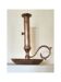 Brass and bronze hand candlestick on a round base and handle