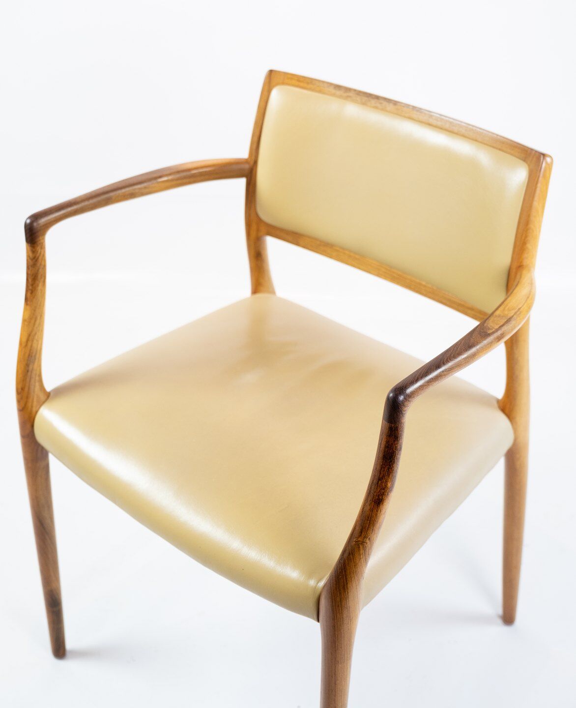 Pair of N.O. Moeller armchairs, model 65, in rosewood and light leather