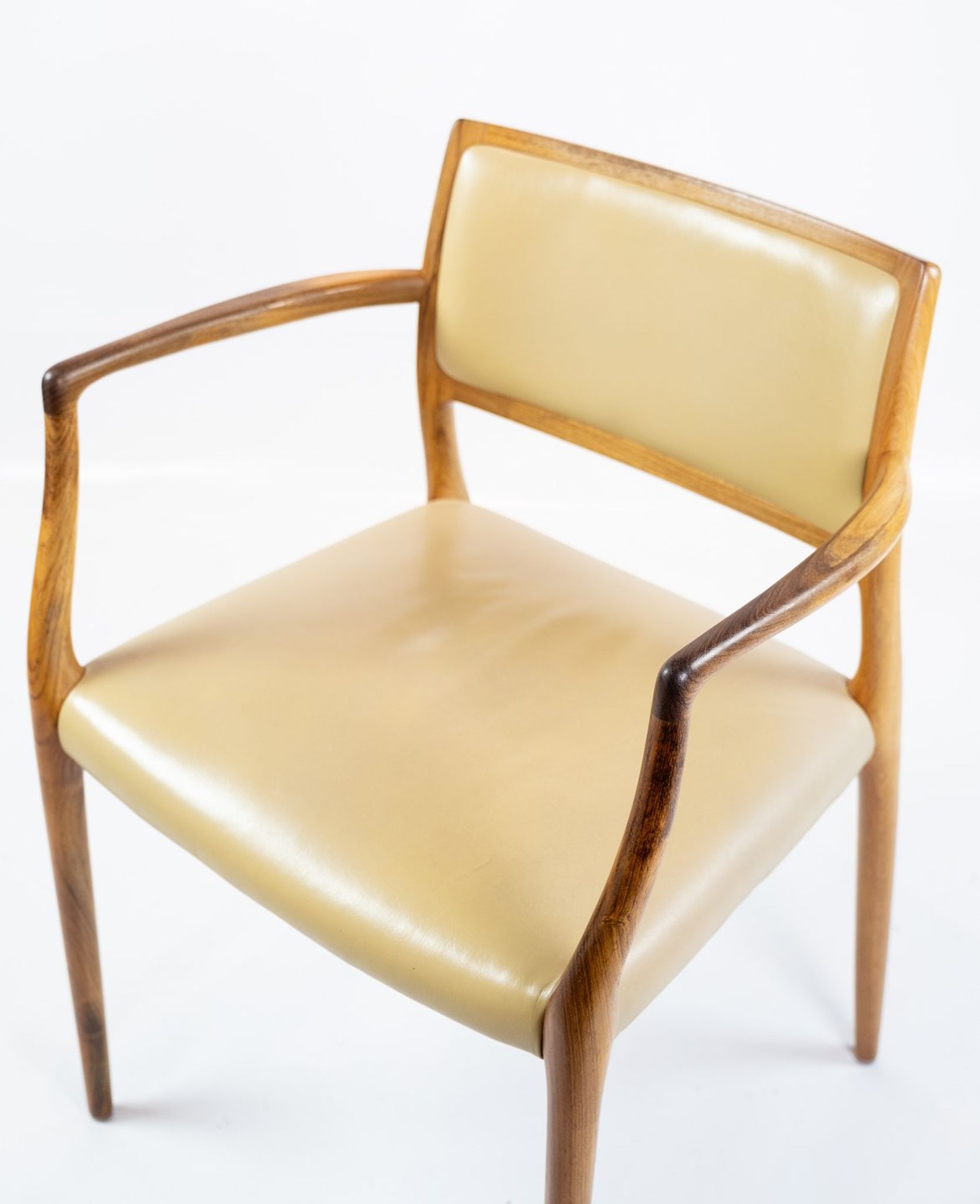 Pair of N.O. Moeller armchairs, model 65, in rosewood and light leather