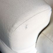 Fauteuil seventies en skaï blanc crème