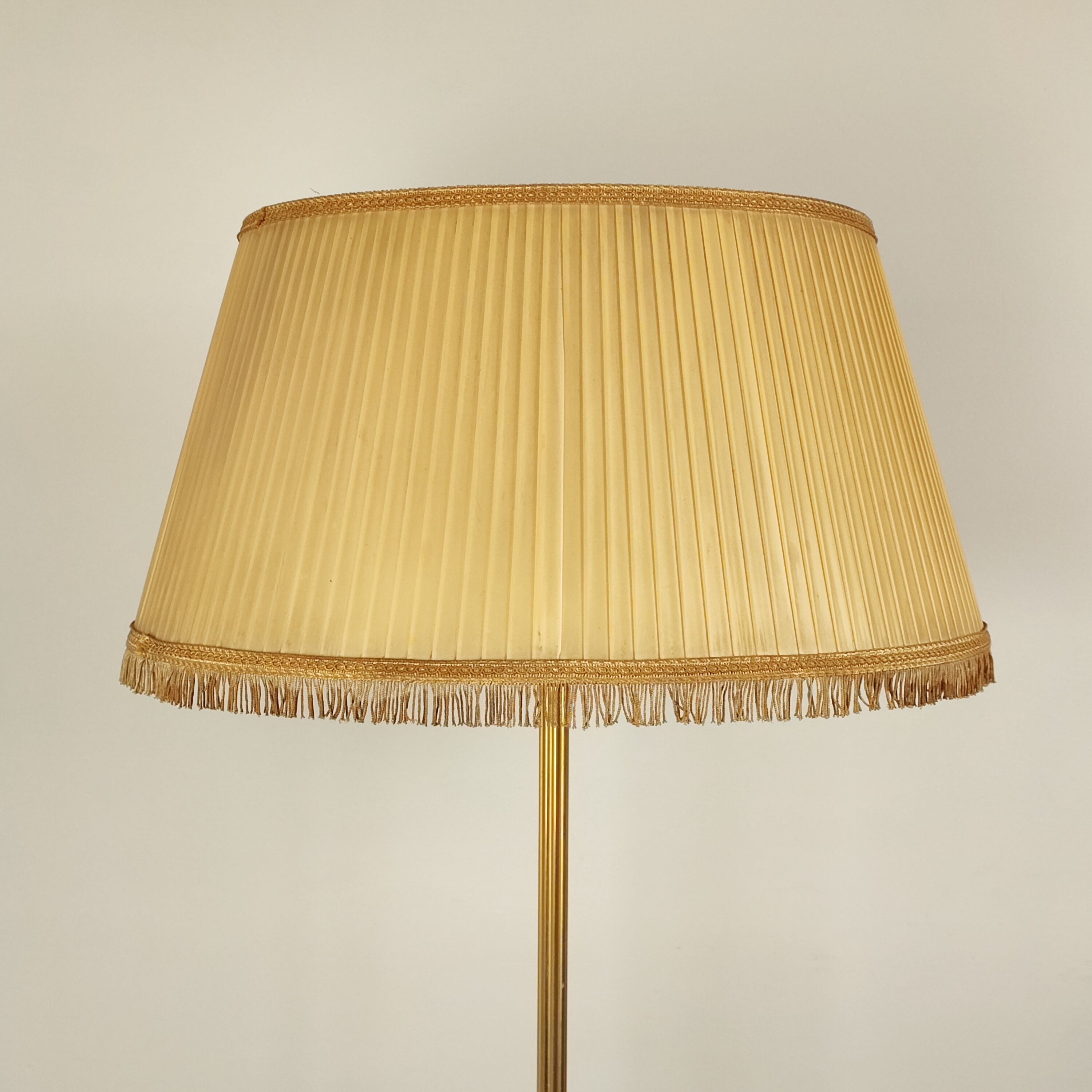 Golden tripod floor lamp