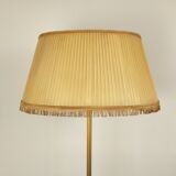 Golden tripod floor lamp