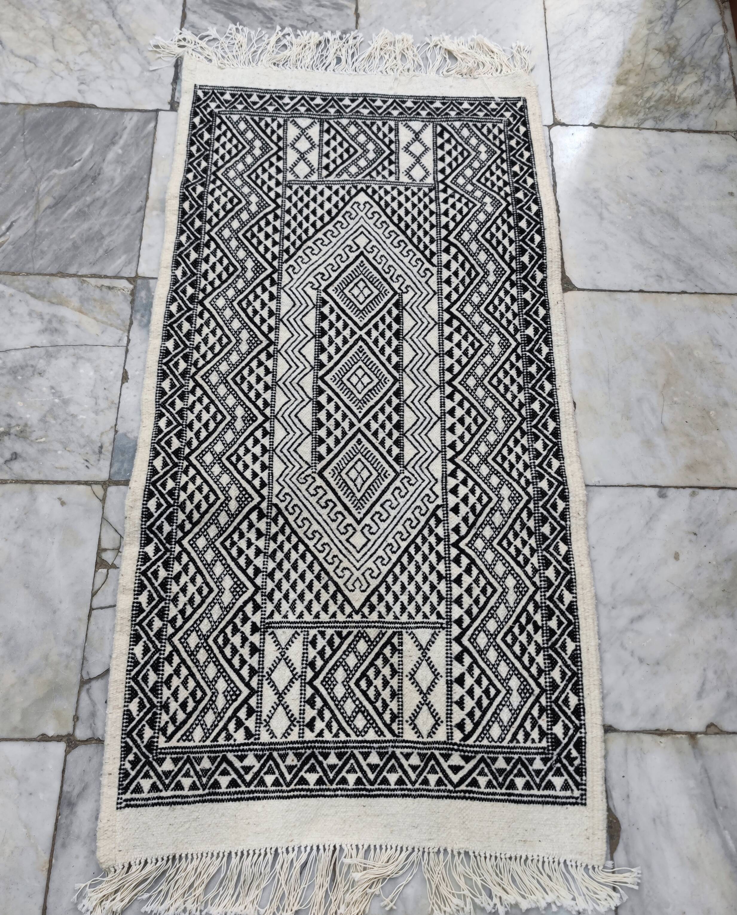 Handwoven black and white rug