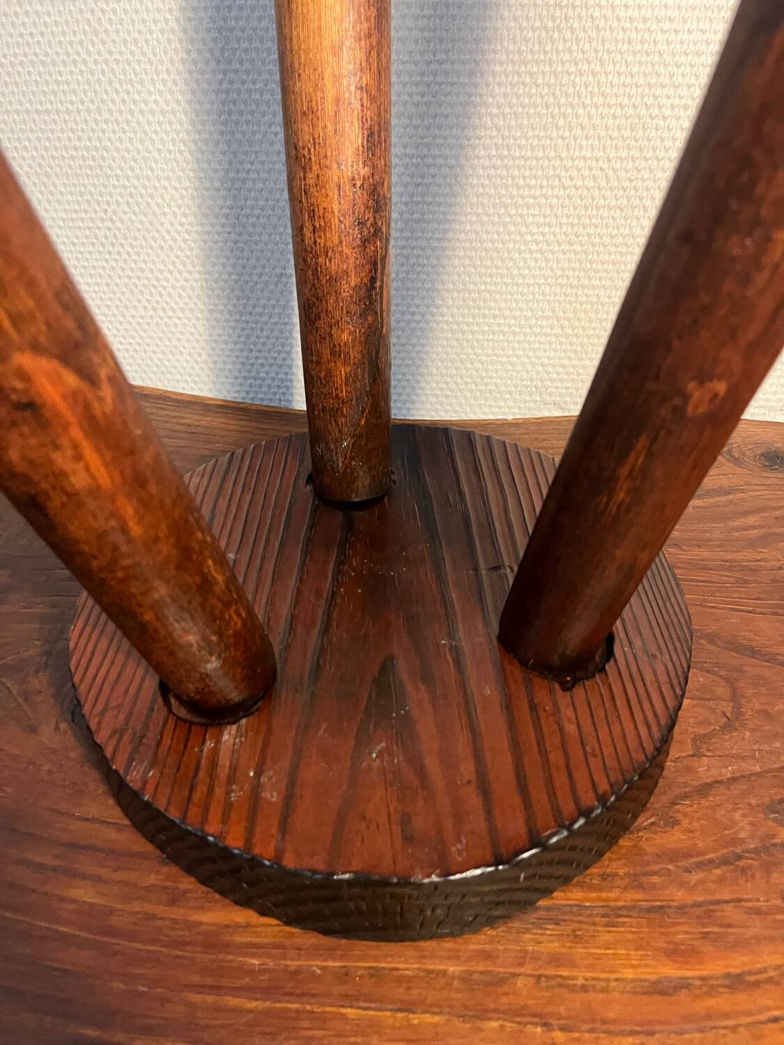 Round wooden tripod stool