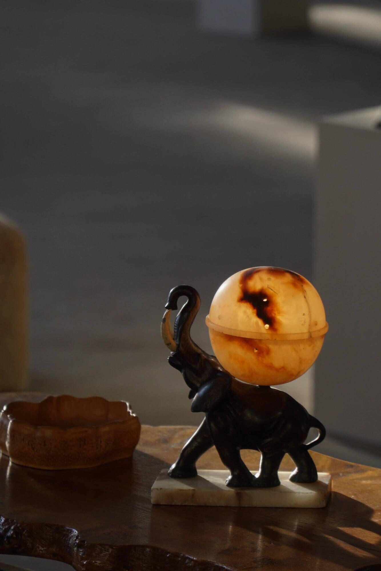 Art Deco, elephant table lamp with alabaster globe, early 20th century, 1930s.