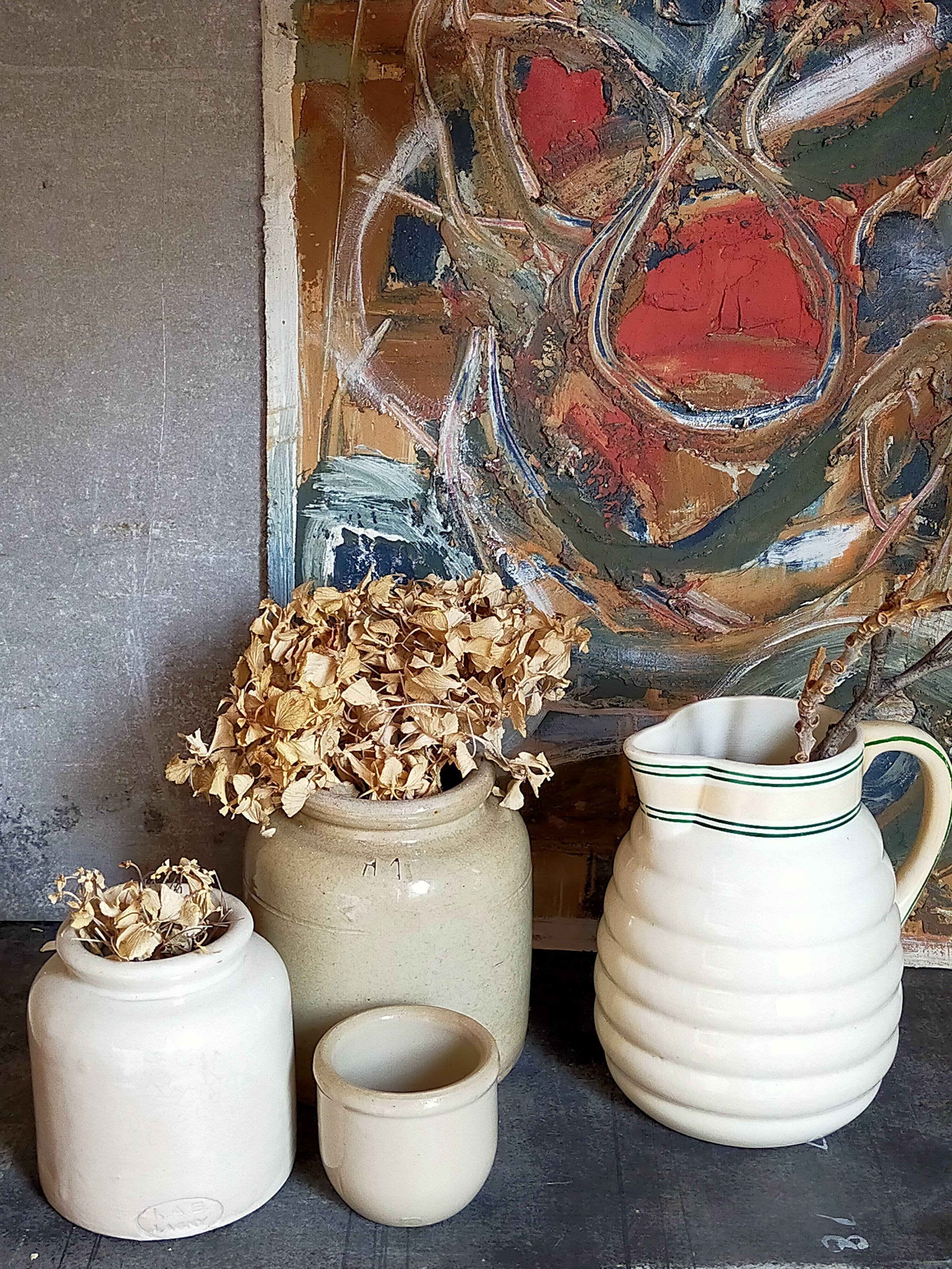 Set of three pots with old condiments in glazed earth