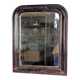 Antique Louis Philippe mirror with a patinated black frame.