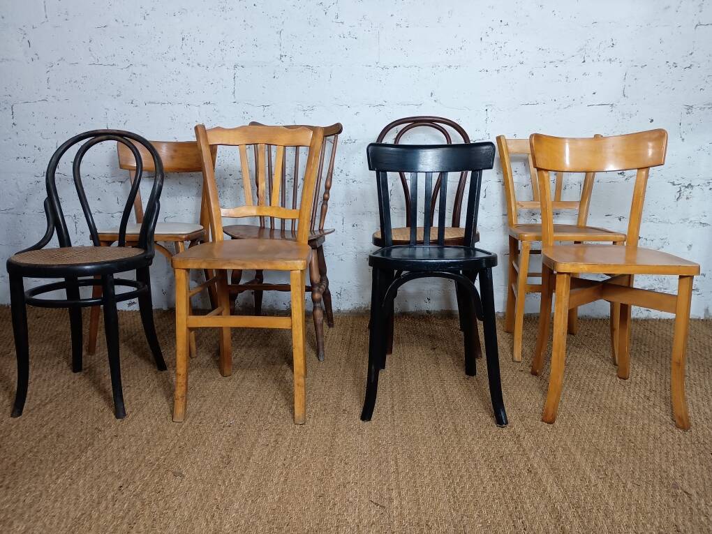 Set of 8 mismatched vintage Baumann Lebrun bistro chairs.