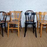 Set of 8 mismatched vintage Baumann Lebrun bistro chairs.