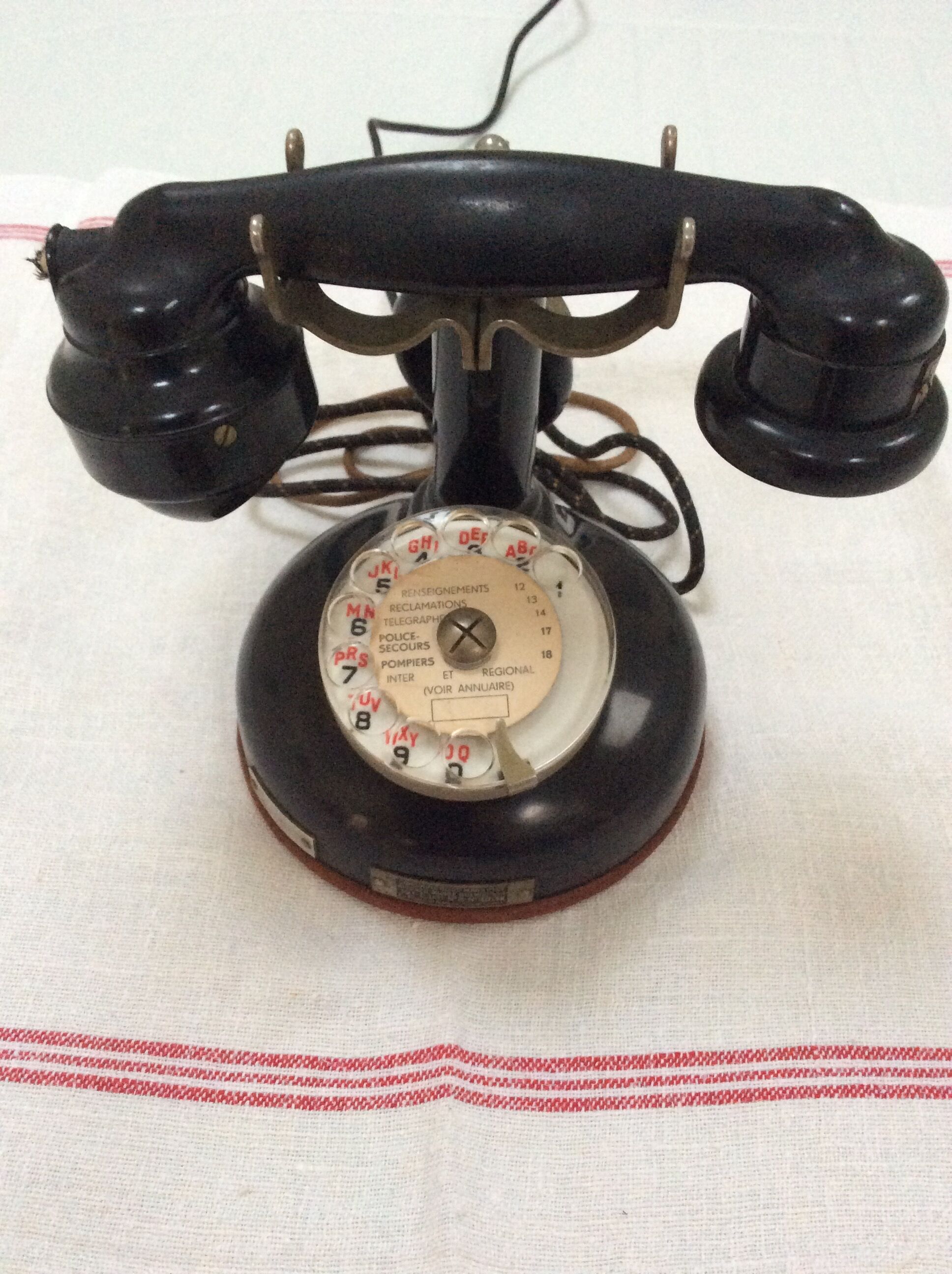 Old Bakelite telephone with column