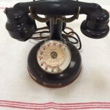 Old Bakelite telephone with column