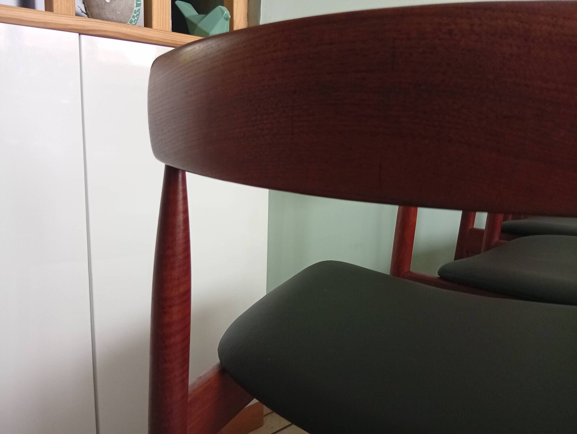 Four Danish mid-century teak armchairs.