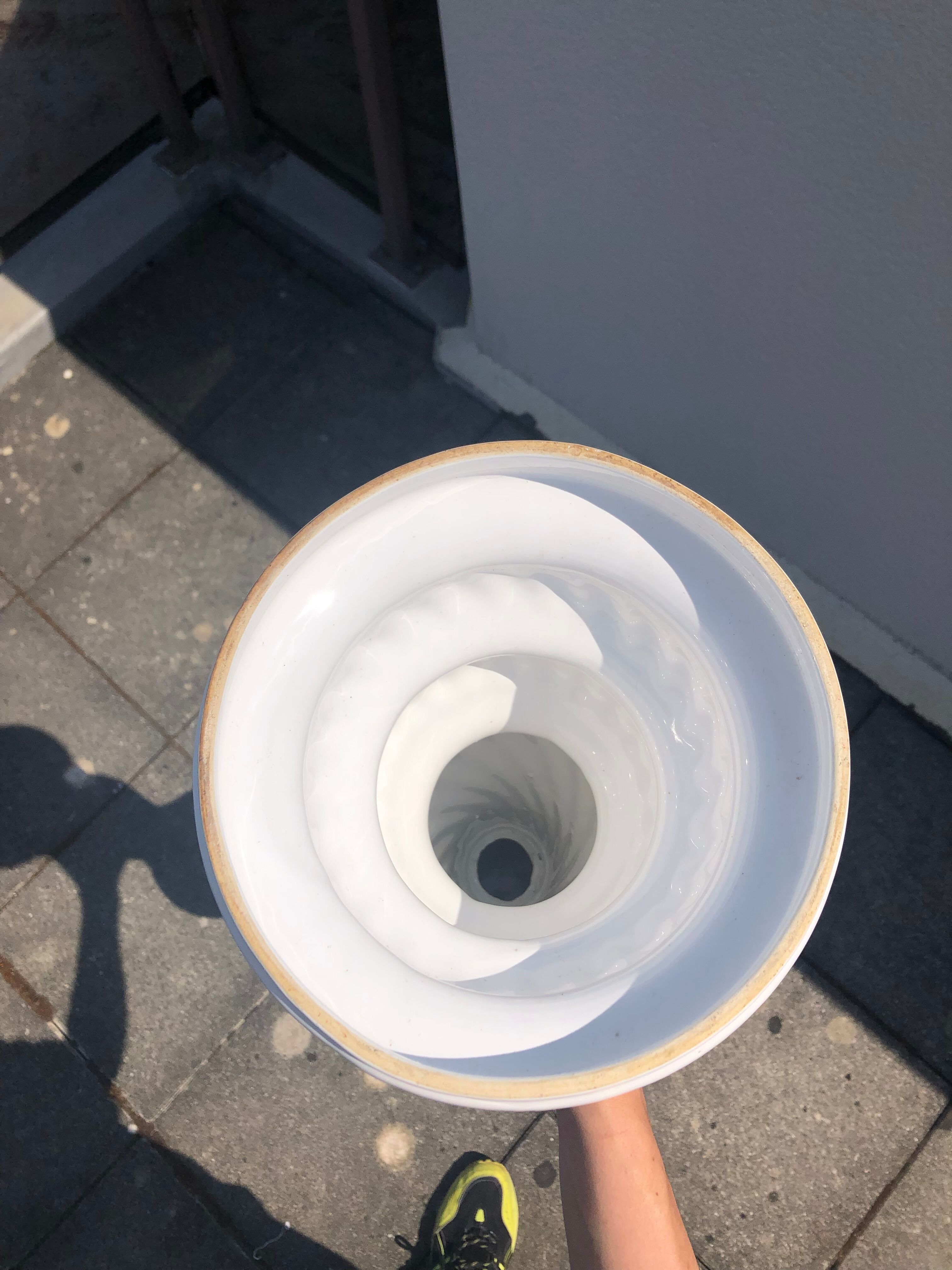 Column and white earthenware pot cover