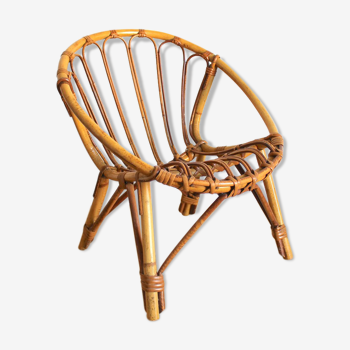 Child chair in rattan shell shape