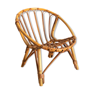 Child chair in rattan shell shape