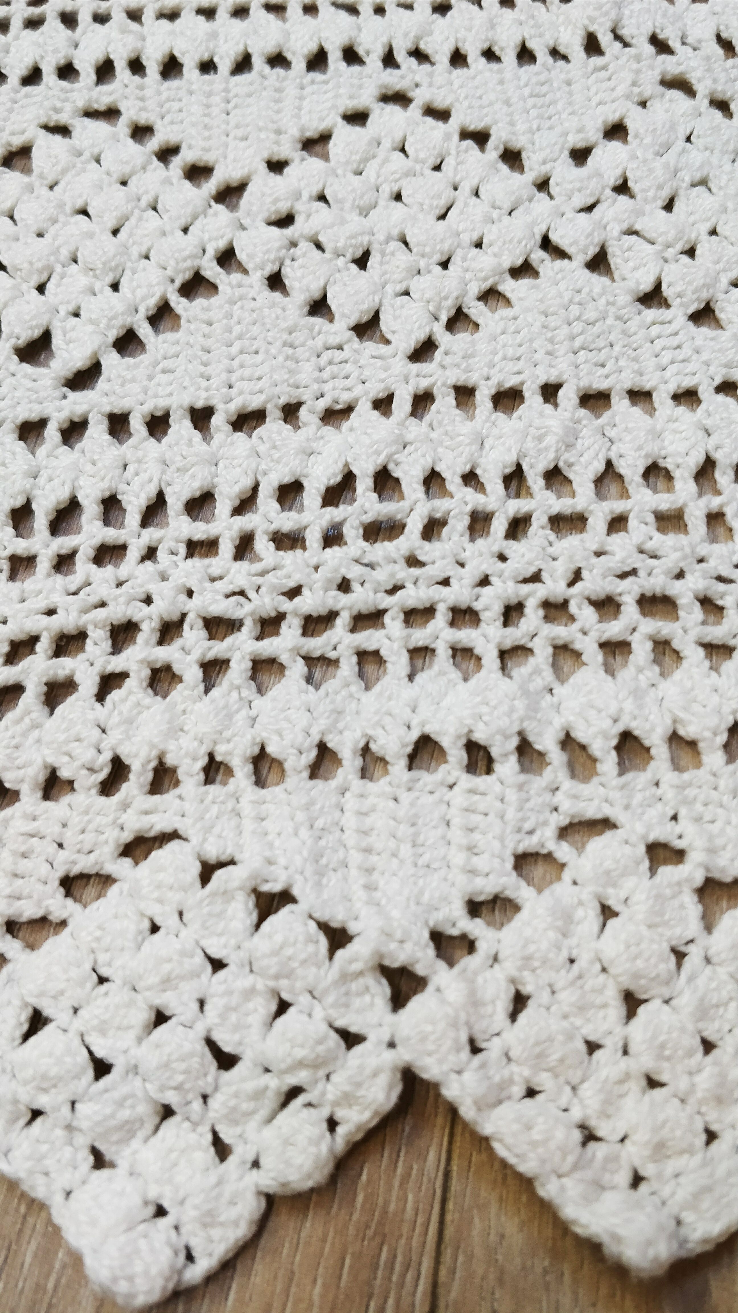 White two-seater crocheted bed top