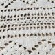 White two-seater crocheted bed top
