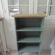 Small vintage bookcase enhanced in smoky green