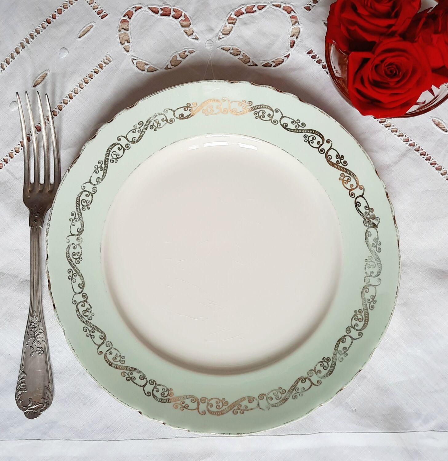 Flat earthenware plates with gilded edges