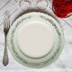 Flat earthenware plates with gilded edges