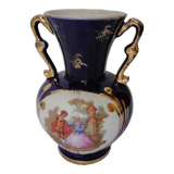 Revol porcelain vase, showcase object, romantic decor, blue background, golden handles