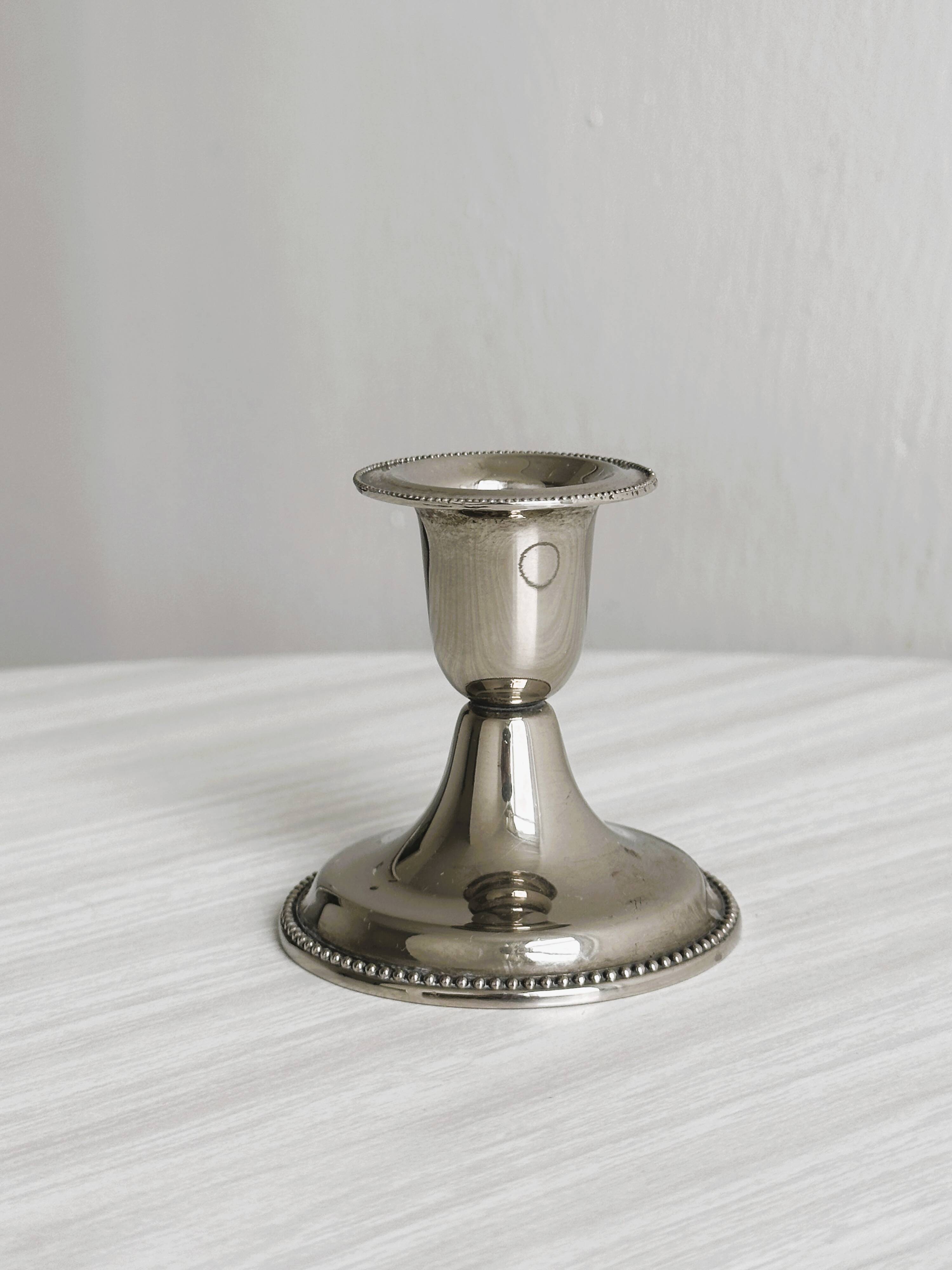 Small antique metal candle holder