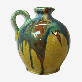Yellow pitcher with green drips
