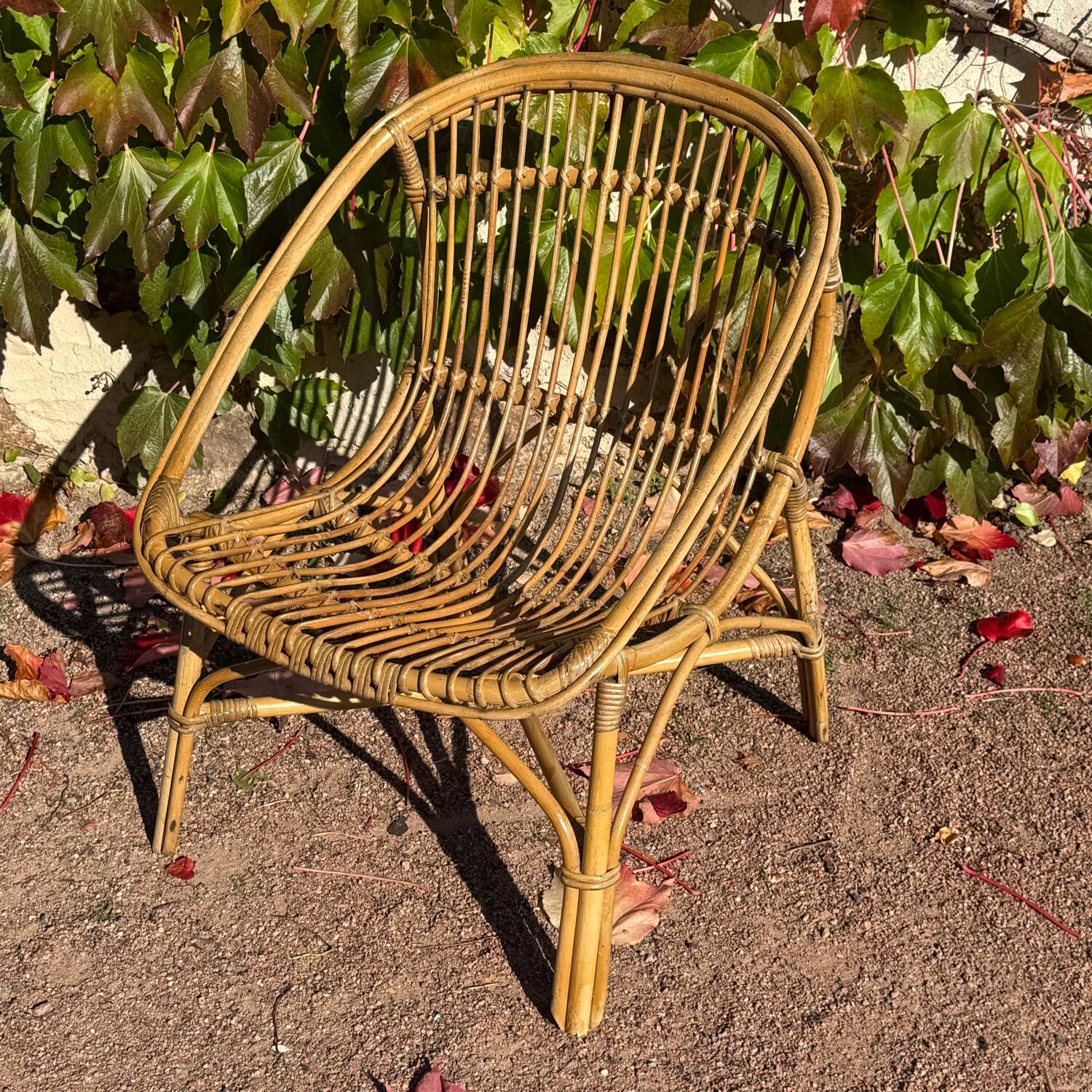 Pair of 1950s rattan armchairs from France.