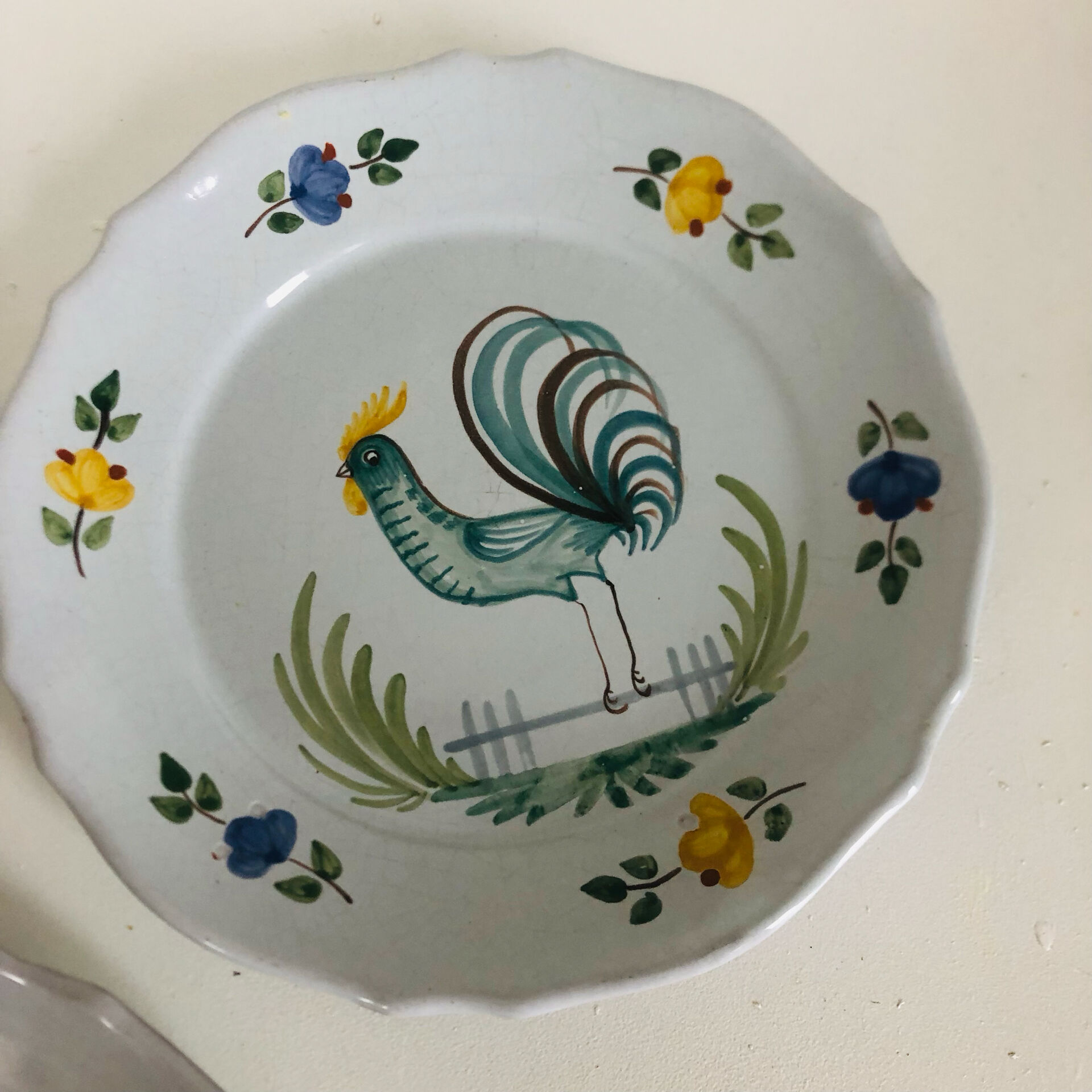 Pair of plates with naive Eastern rooster decoration