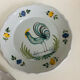 Pair of plates with naive Eastern rooster decoration