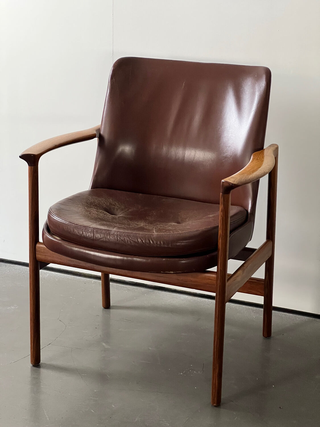 Leather and wood armchair by Ib Kofod Larsen